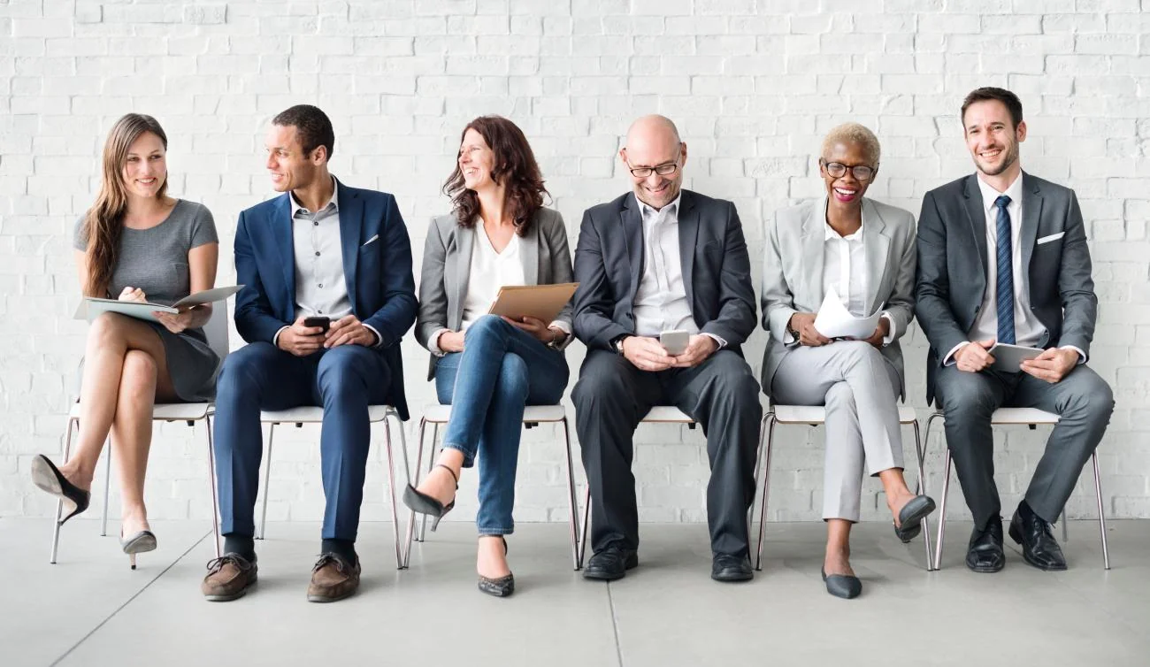 A diverse group of professionals waiting to be interviewed